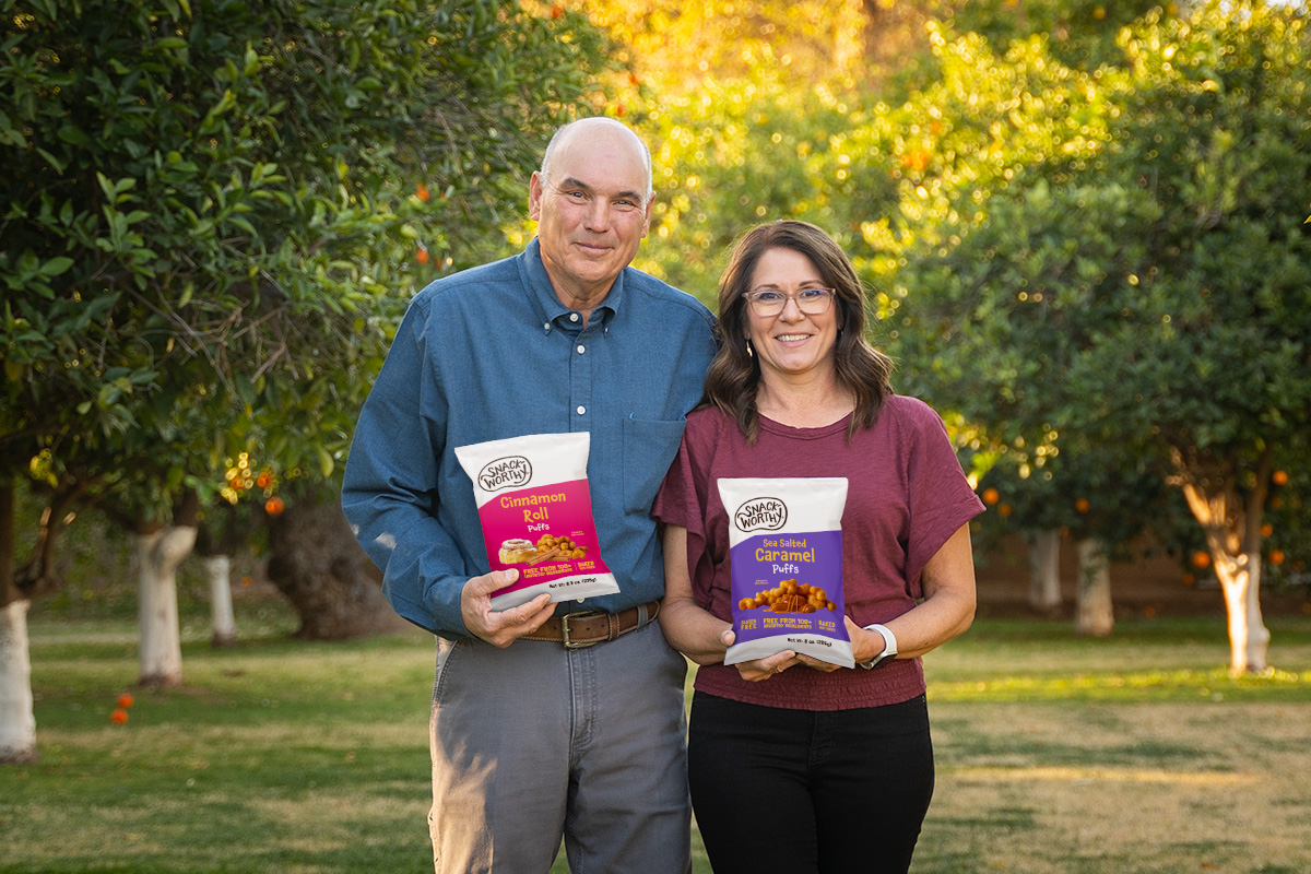 Lehi Valley Founders Lewis and Trecia Freeman holdig snack worthy puffs.